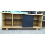 A Ralph Lauren bleached pine finished bookcase with a sliding front door,