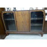 An Art Deco 'Bath Cabinet Makers' crossbanded mahogany display cabinet with a central door,