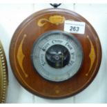 An early 20thC mahogany and marquetry cased hanging aneroid barometer,