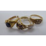 Four variously set gold coloured metal dress rings 11