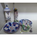 Decorative ceramics: to include a pair of early 20thC Japanese Imari porcelain wavy edged plates