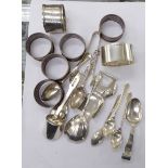Silver: to include a set of five plain napkin rings; a baby's feeding spoon;