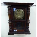 An early/mid 20thC stained beech cased wall clock;