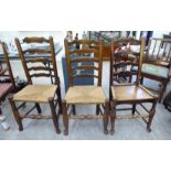 A matched set of three early 20thC Lancashire ash framed ladderback chairs,