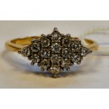 An 18ct gold diamond set cluster ring 11