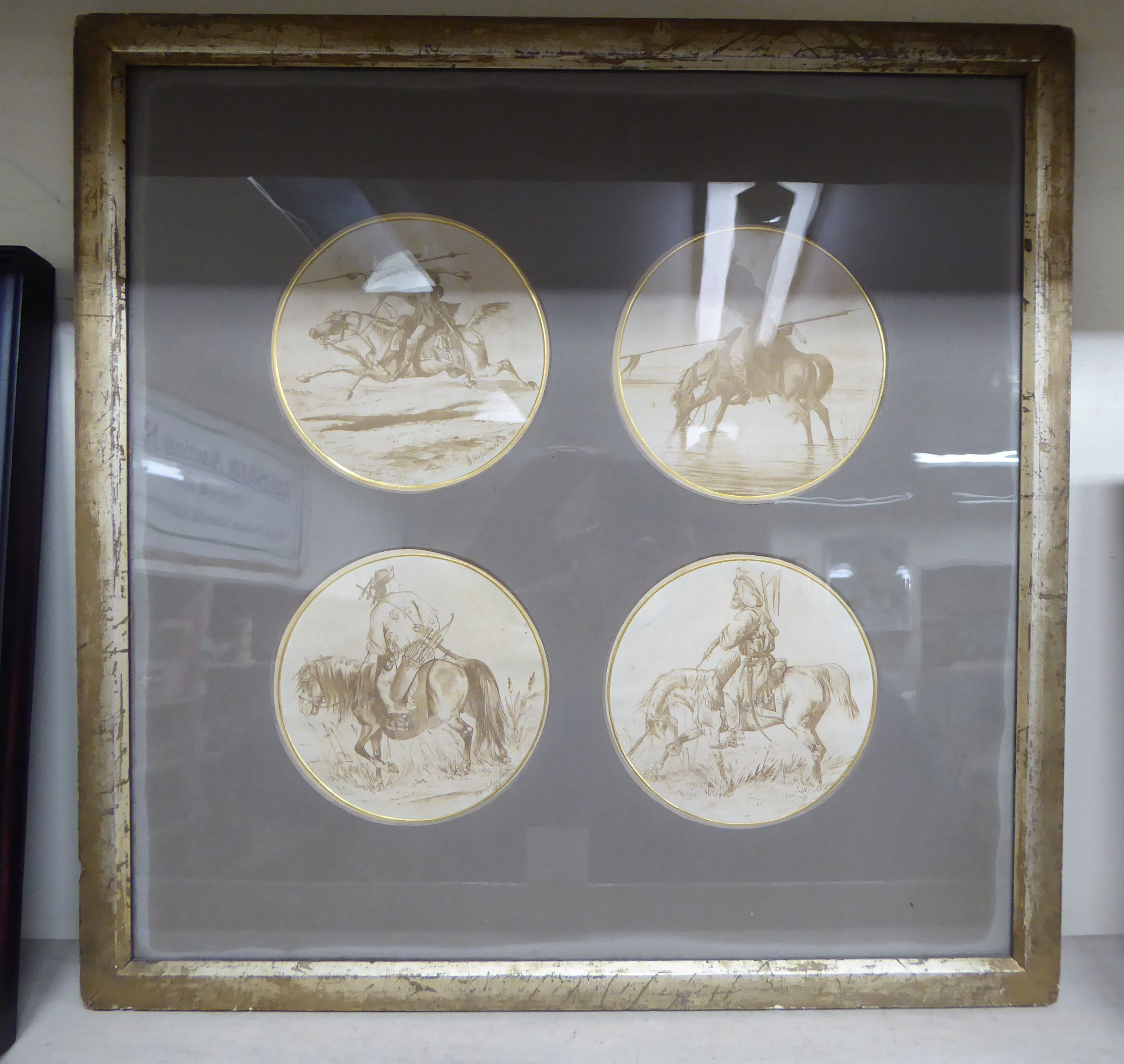 A series of four sepia printed vignette studies of horsemen from the Middle to Far East,