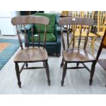 A pair of early 20thC stained beech framed kitchen chairs, each with a curved bar back,