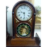A late 19thC Seth Thomas rosewood cased American wall clock of arched form with applied pilasters
