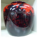 A Royal Doulton flambe glazed china vase of squat, shouldered baluster form,