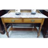 An Edwardian mahogany washstand with a low galleried back and mottled iron red marble top,