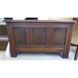 A 20thC Jacobean design miniature oak coffer with a tri-panelled hinged lid 16''h 27''w RAB