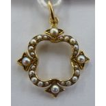 An 'antique' 15ct gold open, quatrefoil framed pendant,