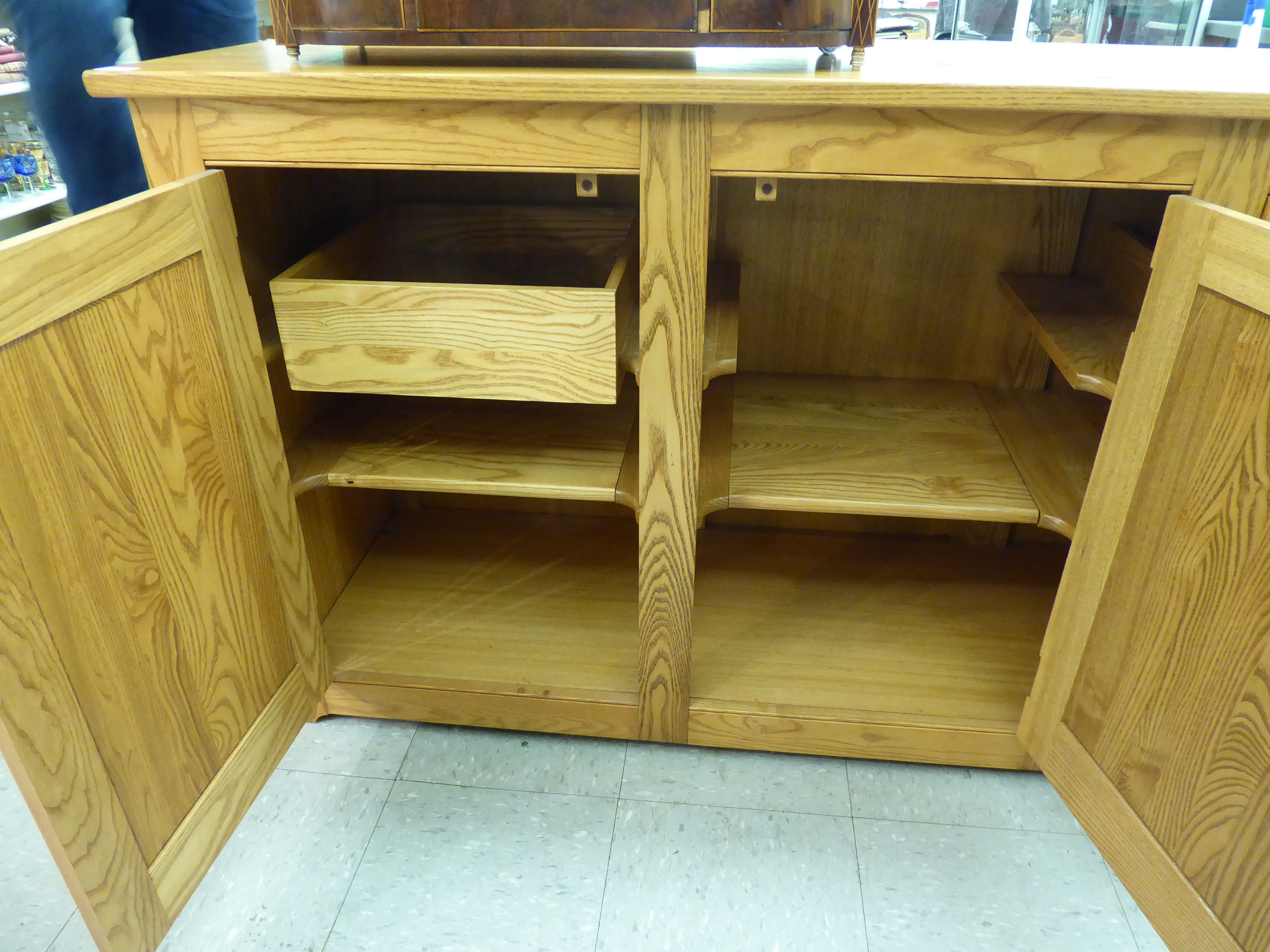 An Ercol elm sideboard with three panelled doors, - Image 2 of 2