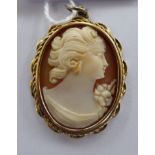 A 9ct gold oval framed, carved profile portrait,