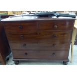A late Victorian mahogany dressing chest with two short/three graduated long drawers,
