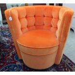 A Lindley orange fabric button upholstered swivel easy chair,