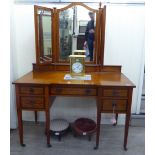 An Edwardian satinwood and ebony inlaid mahogany inverted breakfront dressing table,