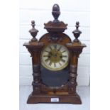 An early 20thC Hamburg American Clock Co stained pine cased mantel clock with decorative mouldings,