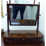 A late Victorian dressing table mirror, the plate set with pivoting horns, over a three drawer base,