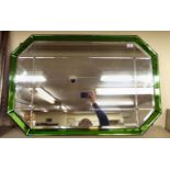 A 1930s Art Deco mirror with a central bevelled plate within a green panelled surround 38'' x 25''