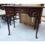 A George III boxwood inlaid mahogany side table with three frieze drawers,