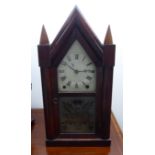 A late 19thC Brewster & Ingrahams American mahogany cased mantel clock with an arched top,