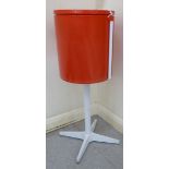 A 1960/70s orange and white plastic vanity unit, on a stand,