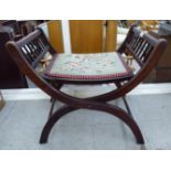 An early 20thC stained beech stool with double height adjustment,