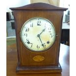 An early 20thC Gilbert Clock Co string inlaid mahogany and marquetry cased mantel clock;