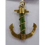 An 'antique' 9ct gold engraved and jade set anchor pendant 11