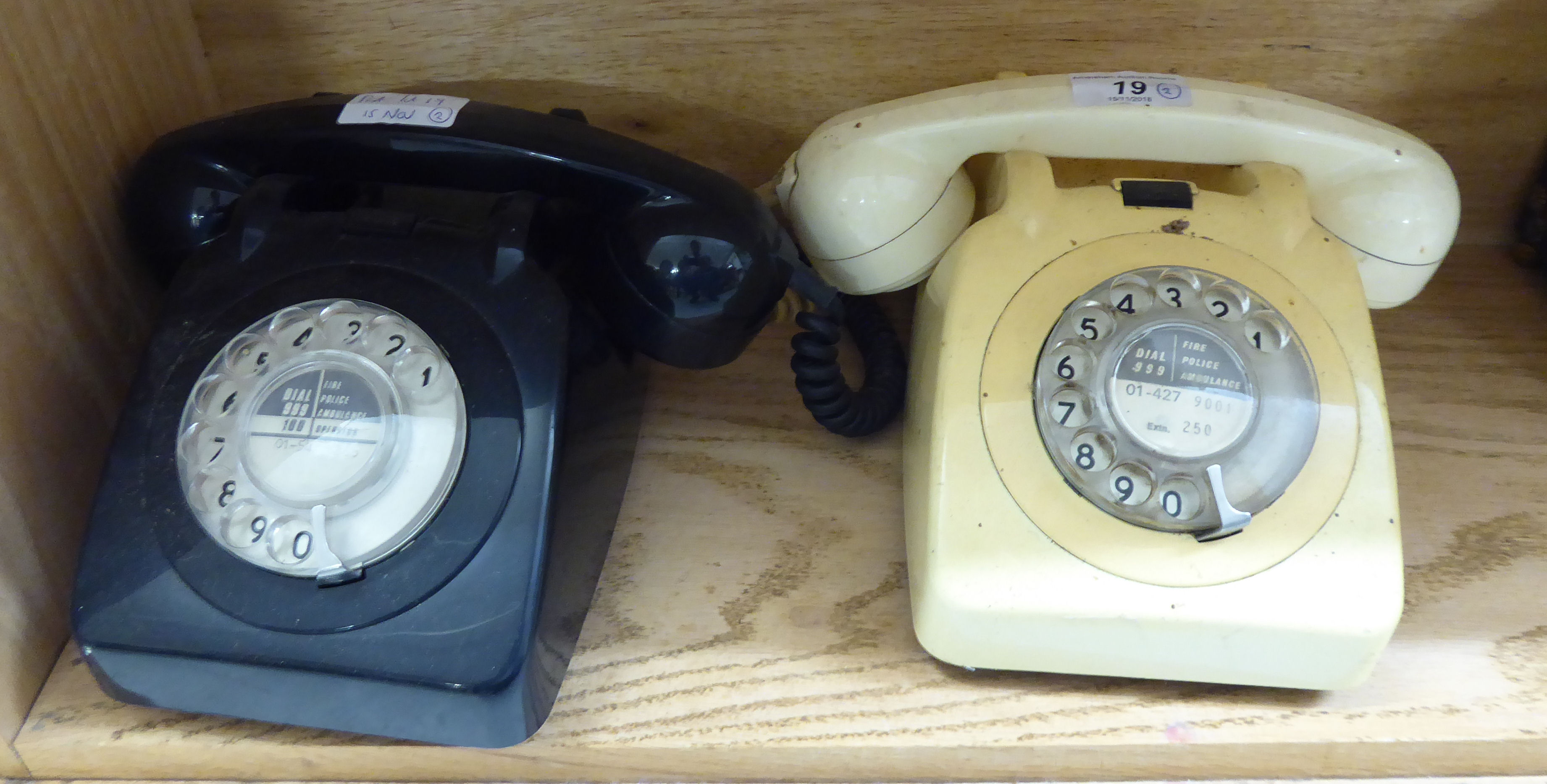 A 'vintage' cream coloured plastic dial type telephone handset;