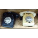 A 'vintage' cream coloured plastic dial type telephone handset;