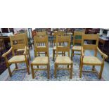 A set of eight modern light oak framed twin bar back dining chairs, the rush seats raised on square,