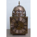 An 'antique' but later adapted brass lantern clock of traditional design;