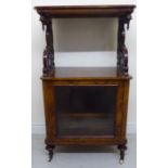 A late Victorian figured and fretworked walnut and satinwood marquetry music cabinet,