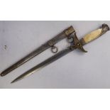 A German diplomat's dagger by Eickhorn with a mother-of-pearl handgrip and swastika emblem on the