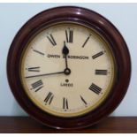 A late 19thC oak cased wall timepiece with a turned surround;