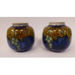 A pair of Royal Doulton green, brown and blue glazed stoneware vases of bulbous form,