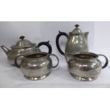 A 'Tudric' spot-hammered pewter four piece tea set for Liberty & Co of squat,