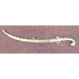 A 19thC Persian short sword with a cast and chased brass bird's head handle,