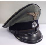 A German SS peaked cap, having black piping,