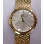 A 1970s Omega gold coloured metal slim cased, wide flexible link bracelet wristwatch,