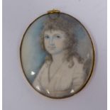 An early 19thC head and shoulders portrait miniature, a young woman,