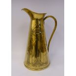 An Art Nouveau J&S brass ewer, having a rivetted loop handle and rolled rim,