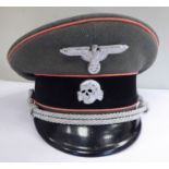 A German SS peaked cap, having pink piping,