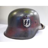 A German SS helmet with a single decal,