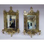 A pair of late 19th/early 20thC girondoles, each comprising a rectangular, bevelled mirror,