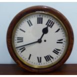 A late Victorian oak cased wall clock with a turned surround;