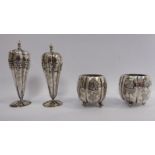 A Chinese four piece silver coloured metal condiments set of segmented, lobed form,