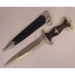 A German SS dagger with a moulded wooden handgrip and applied emblems, the blade 8.